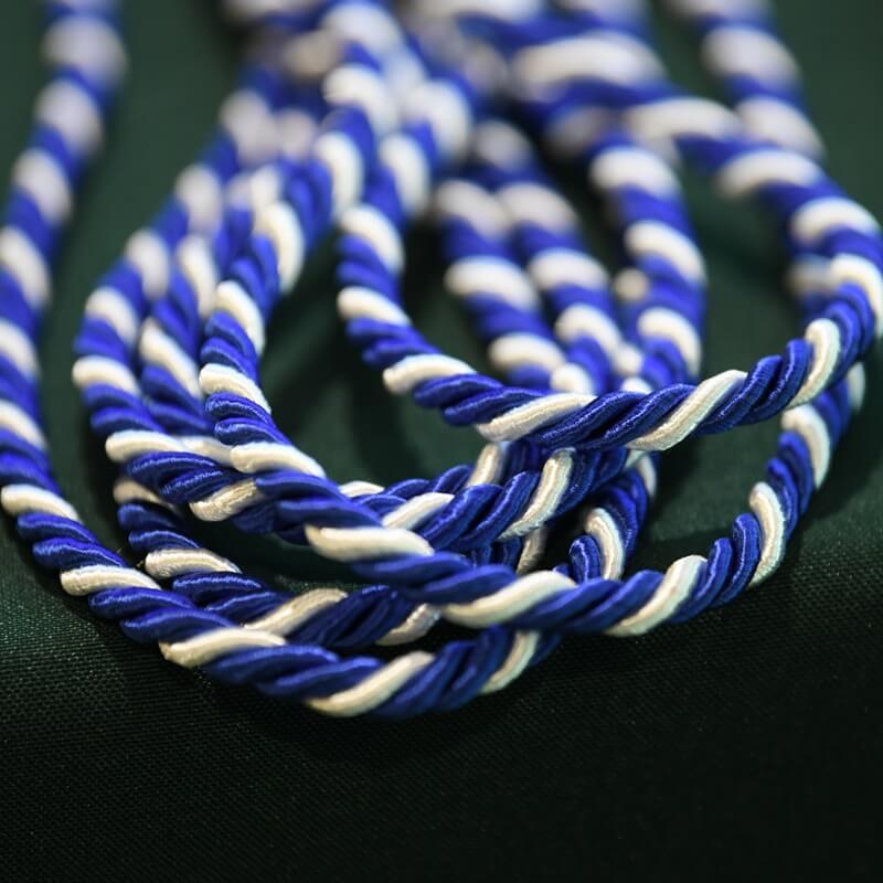 white and blue ceremonial cord