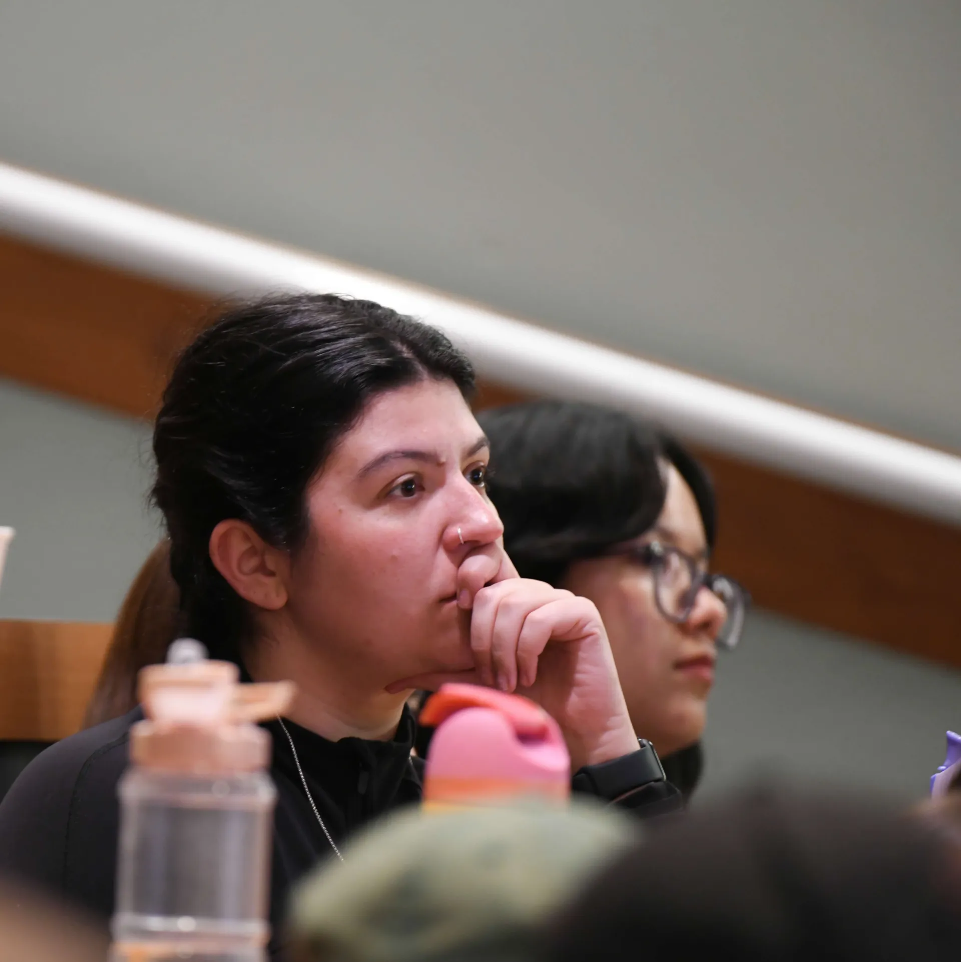A student intently listening to a lecture