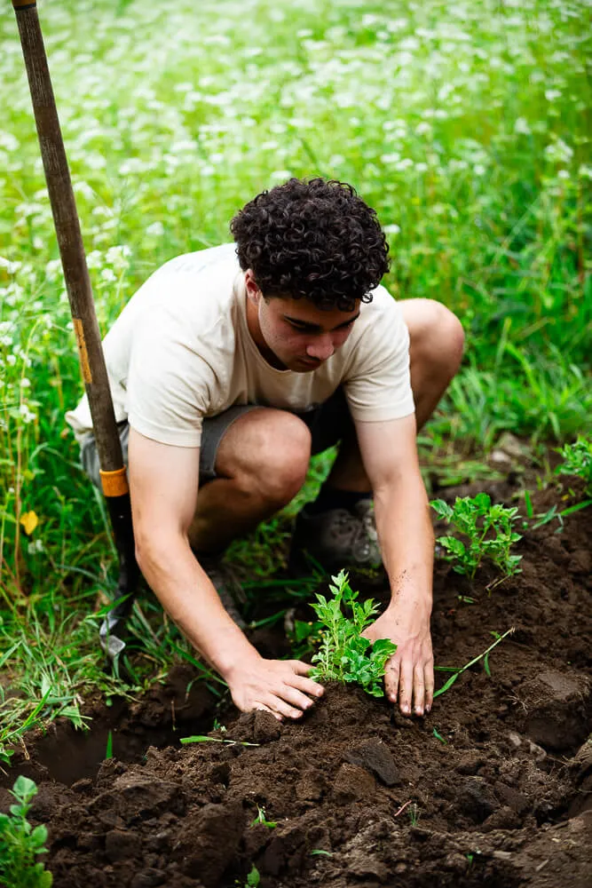 Student working in the dirt