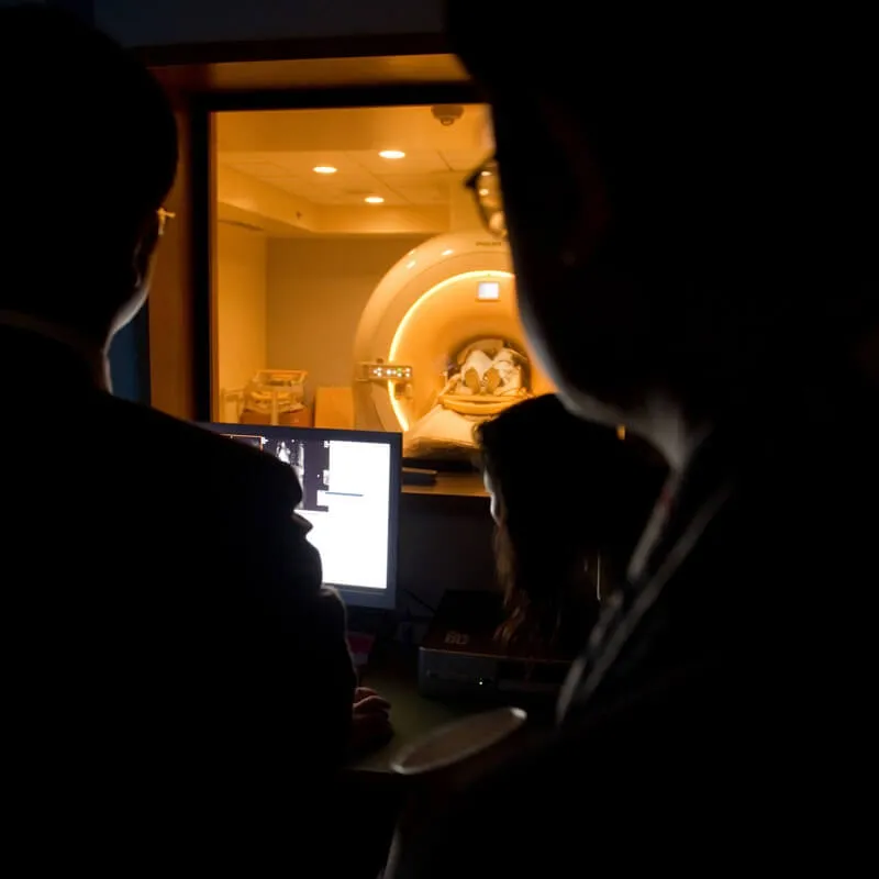 dark room with doctors reading MRI results