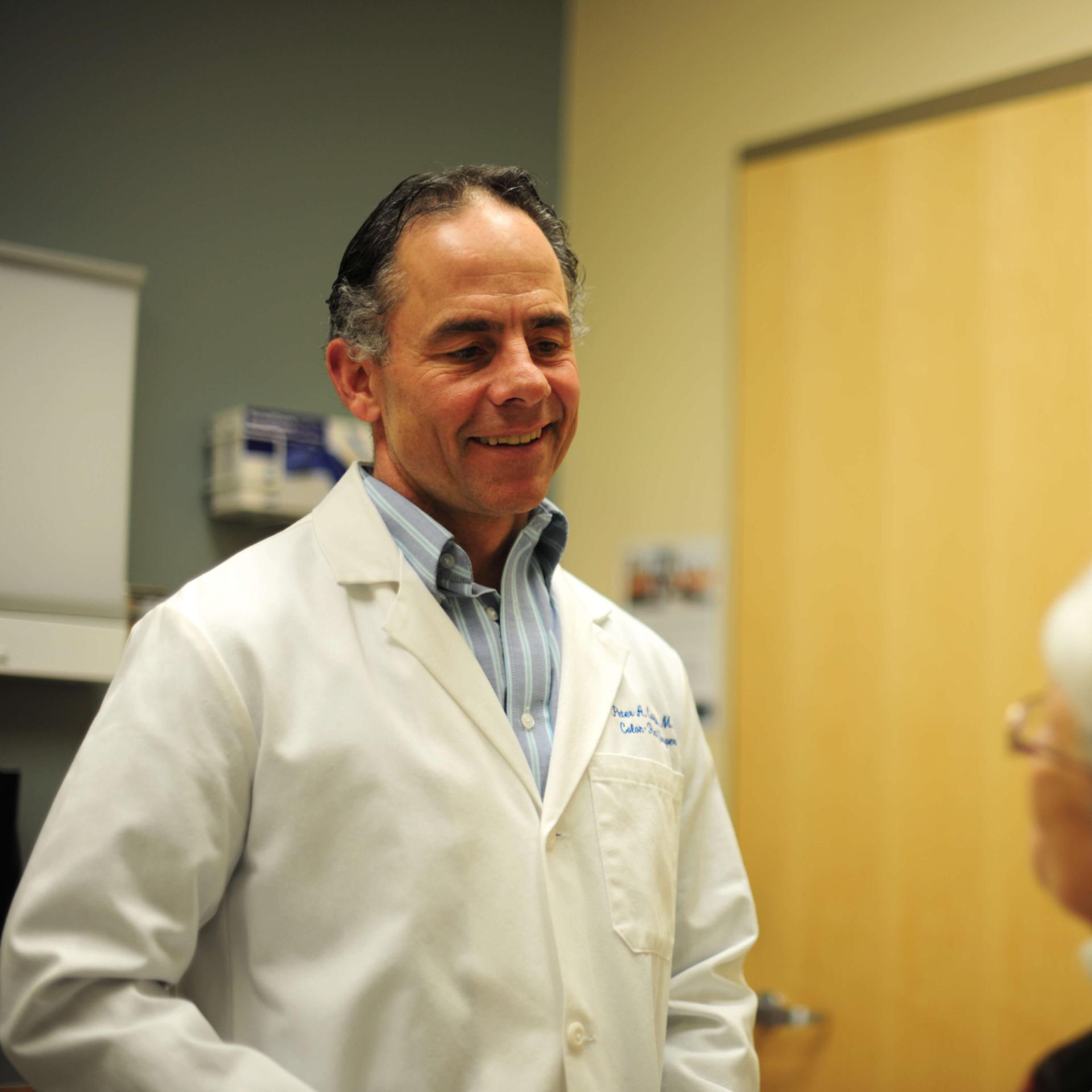 A doctor discussing patient care with a patient.