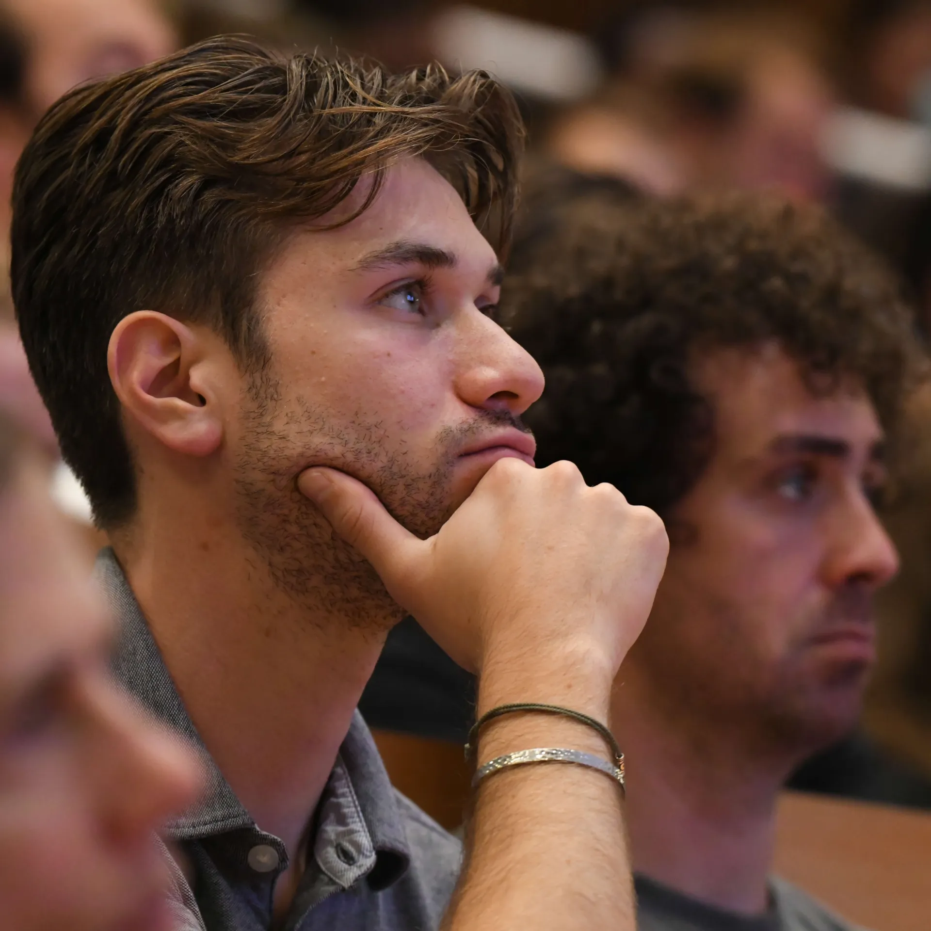 A medical student listening to a lecture.
