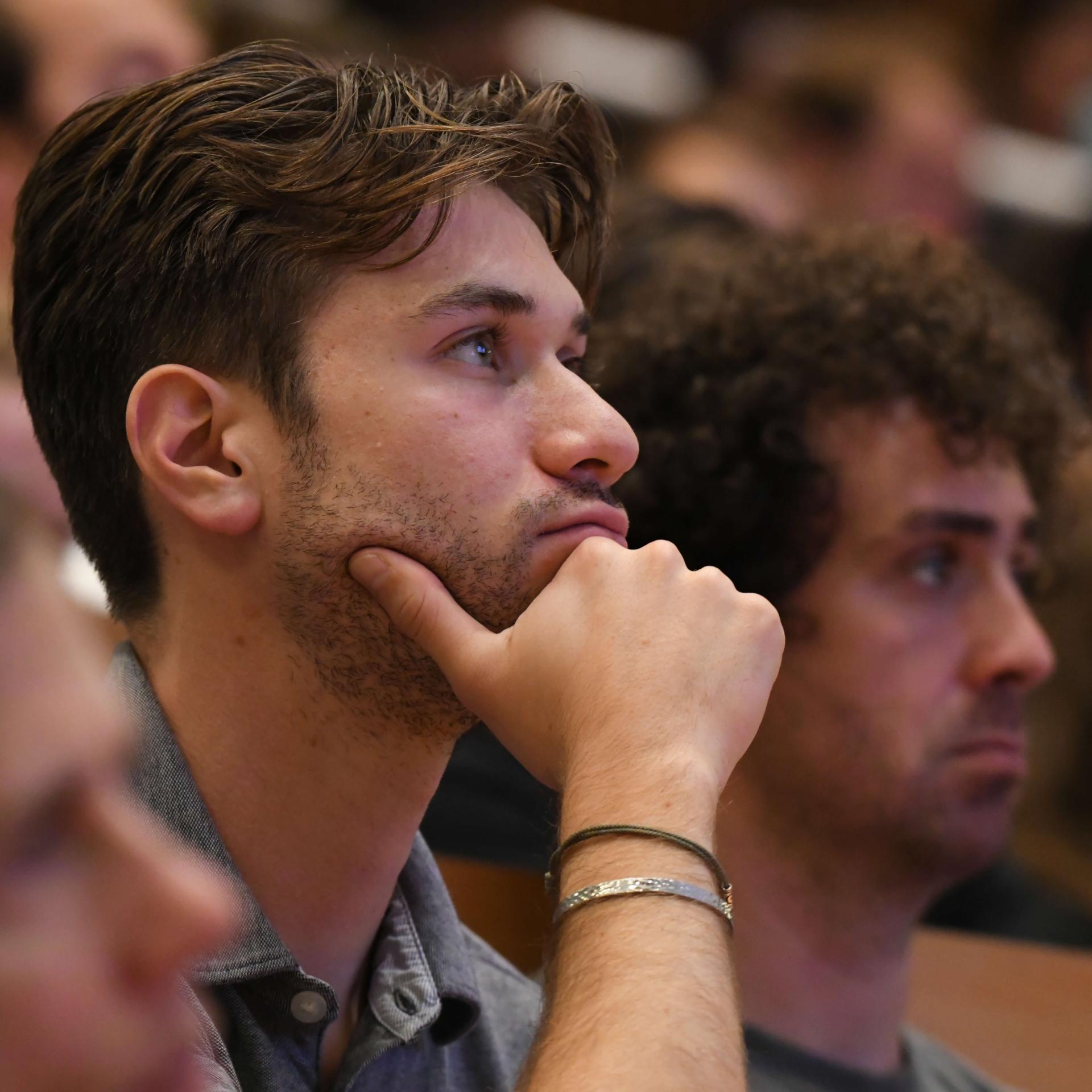 A medical student listening to a lecture.