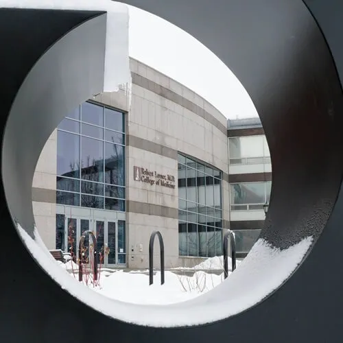 View of building through an abstract sculpture