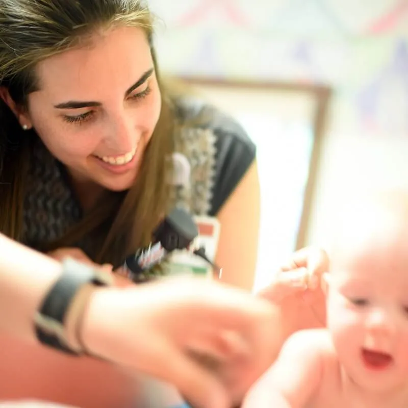 Mother laughing at infant