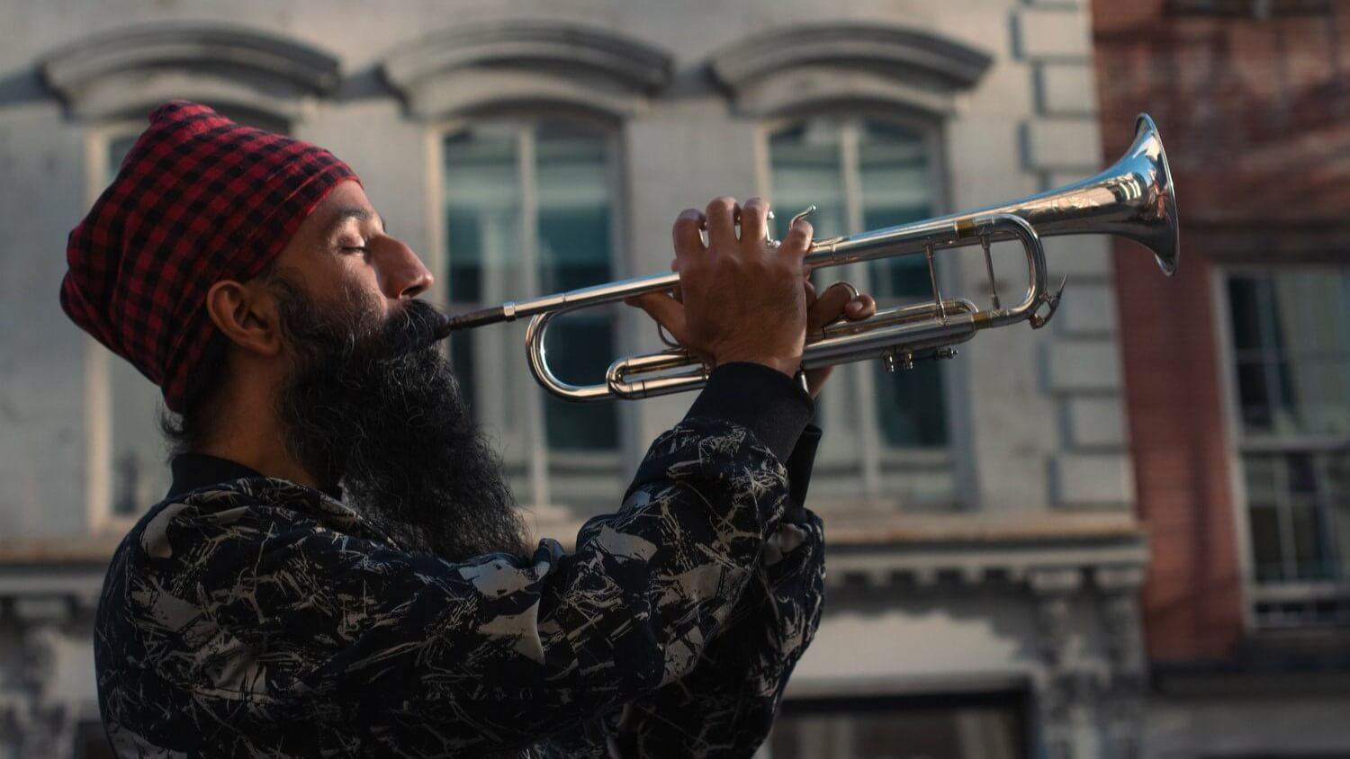 Sonny Singh playing the trumpet