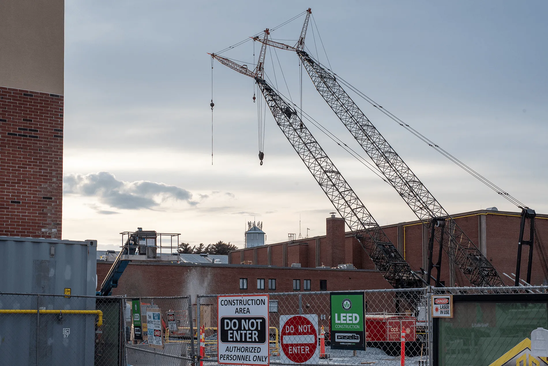 A construction site with a crane on the UVM campus