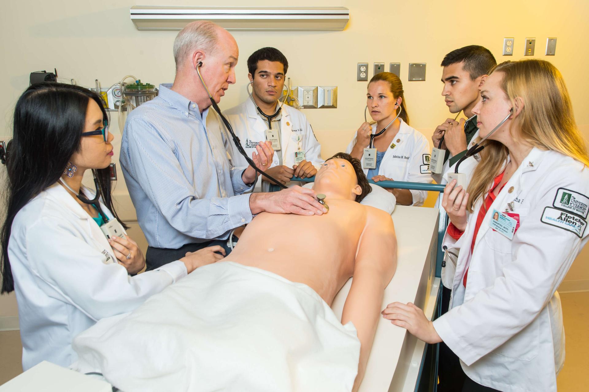 Students training to listen to heartbeat