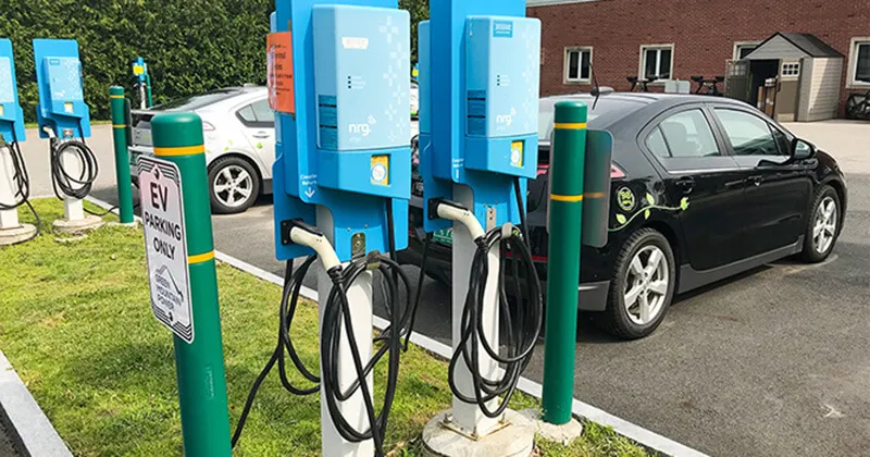 EVs plugged into a charging station