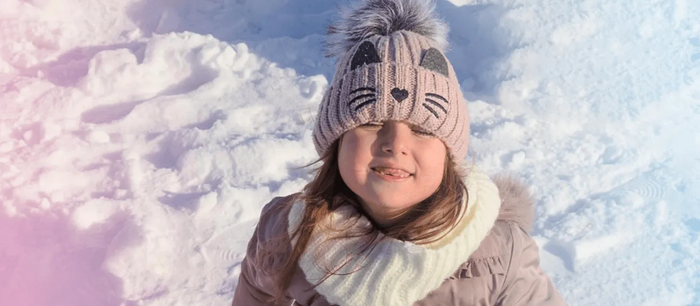 child playing in snow