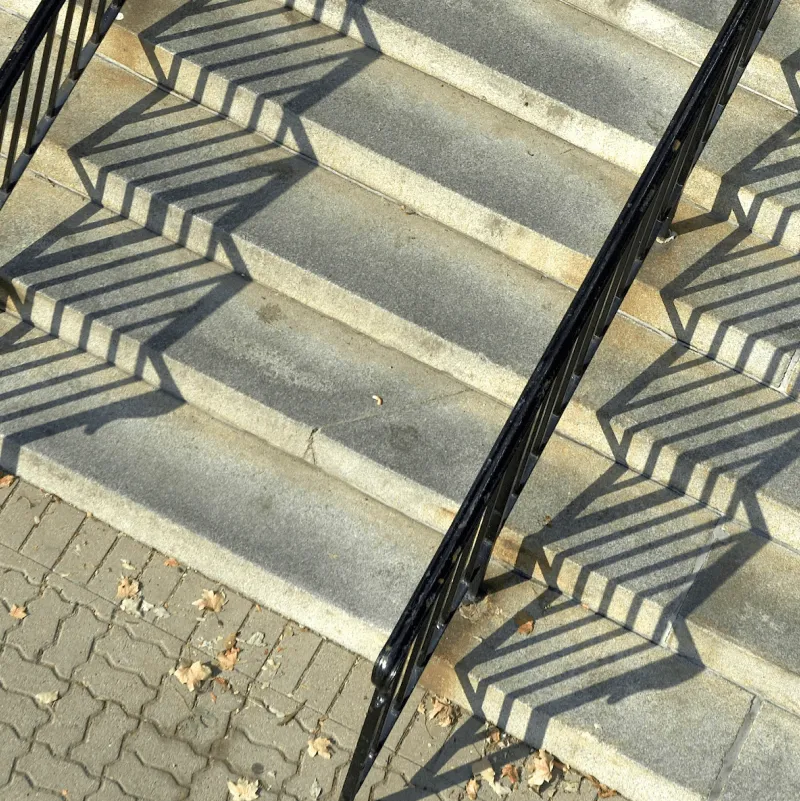 abstract shadows cast on granite steps