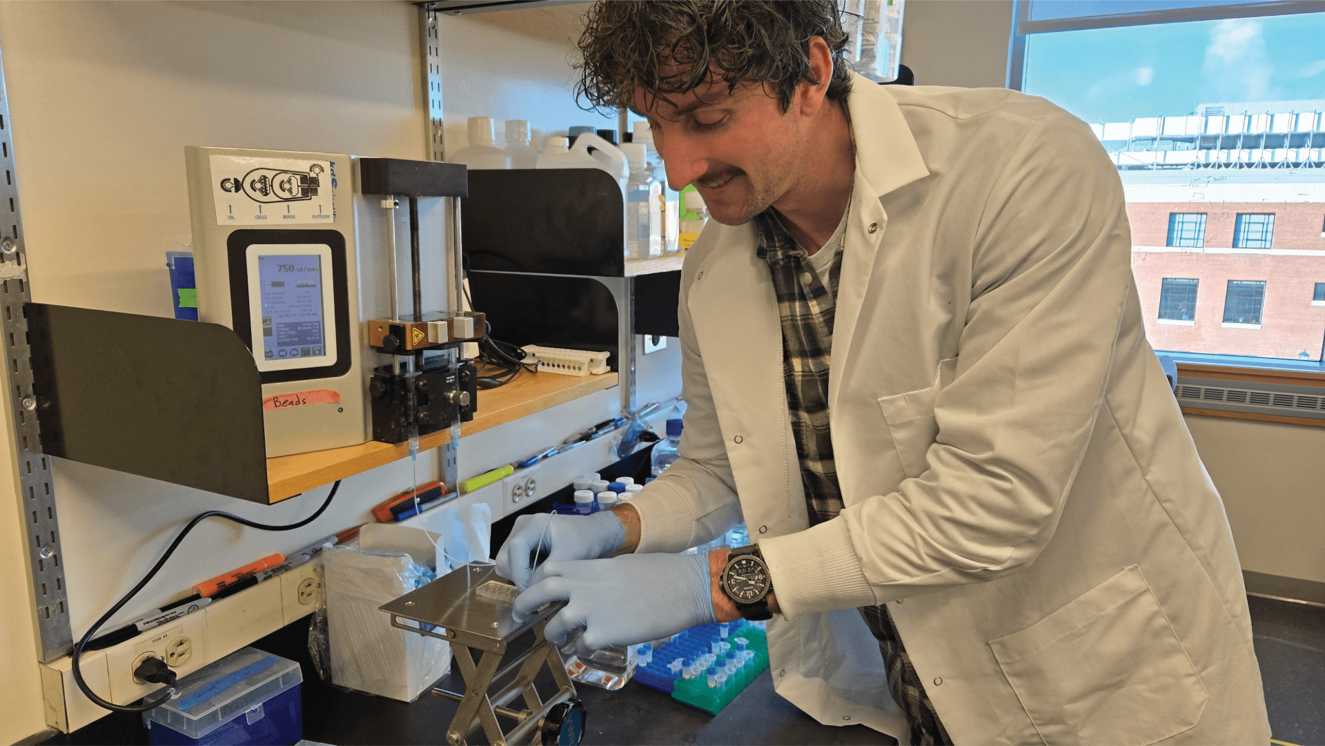 Scientist wearing a white coat conducts research 