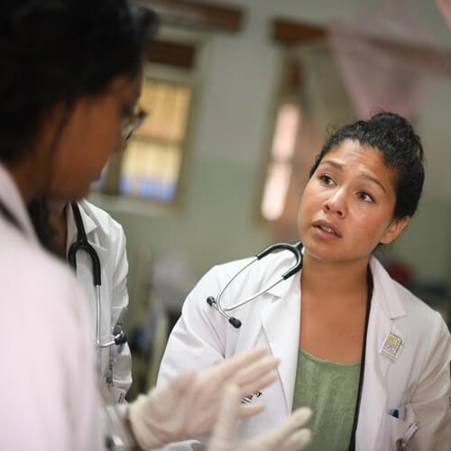 Two doctors speaking to each other