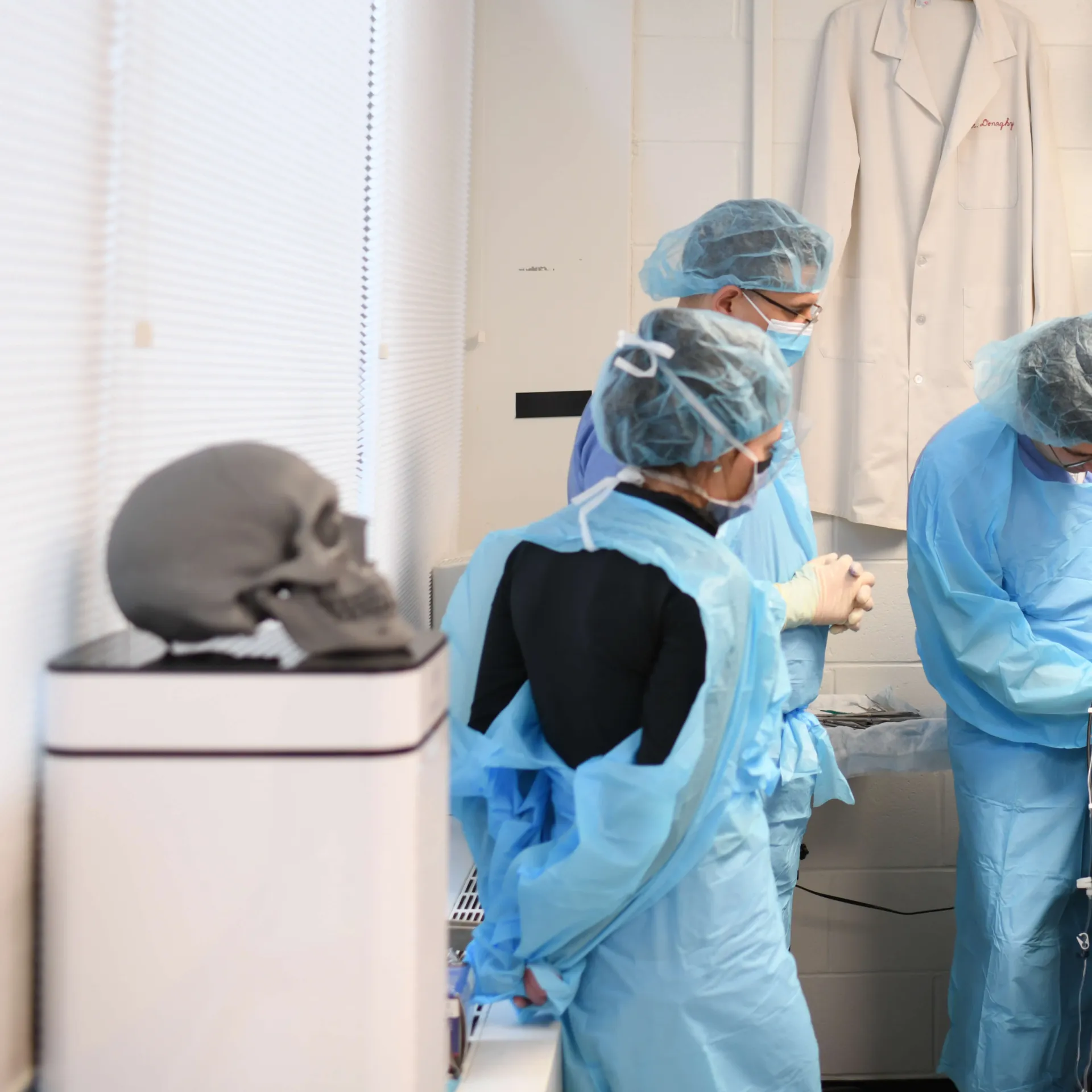 Skull watching students watch demonstration