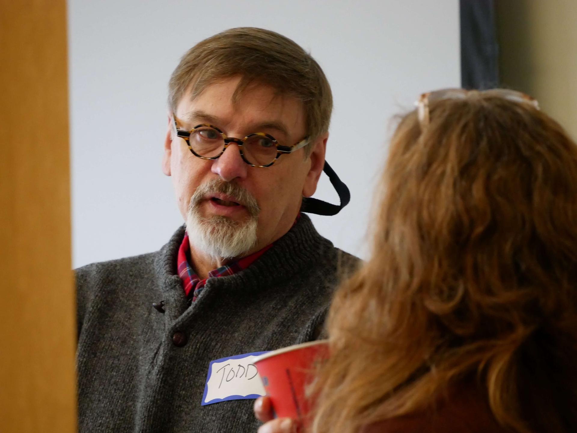 A faculty member meets with a member of the career center