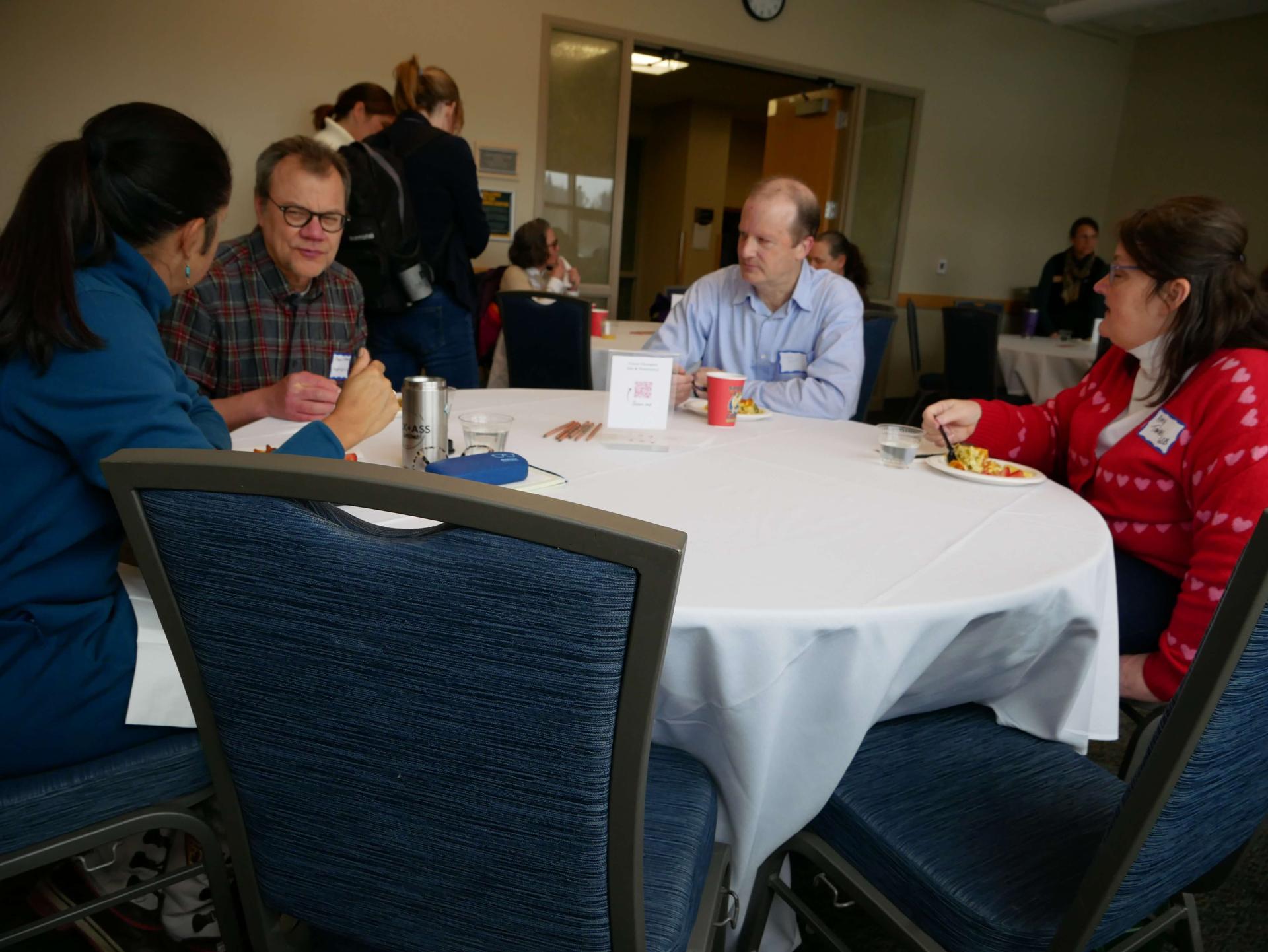 Faculty and staff enjoy breakfast in the Davis Center