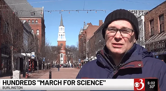 screenshot of a man on the street being interviewed