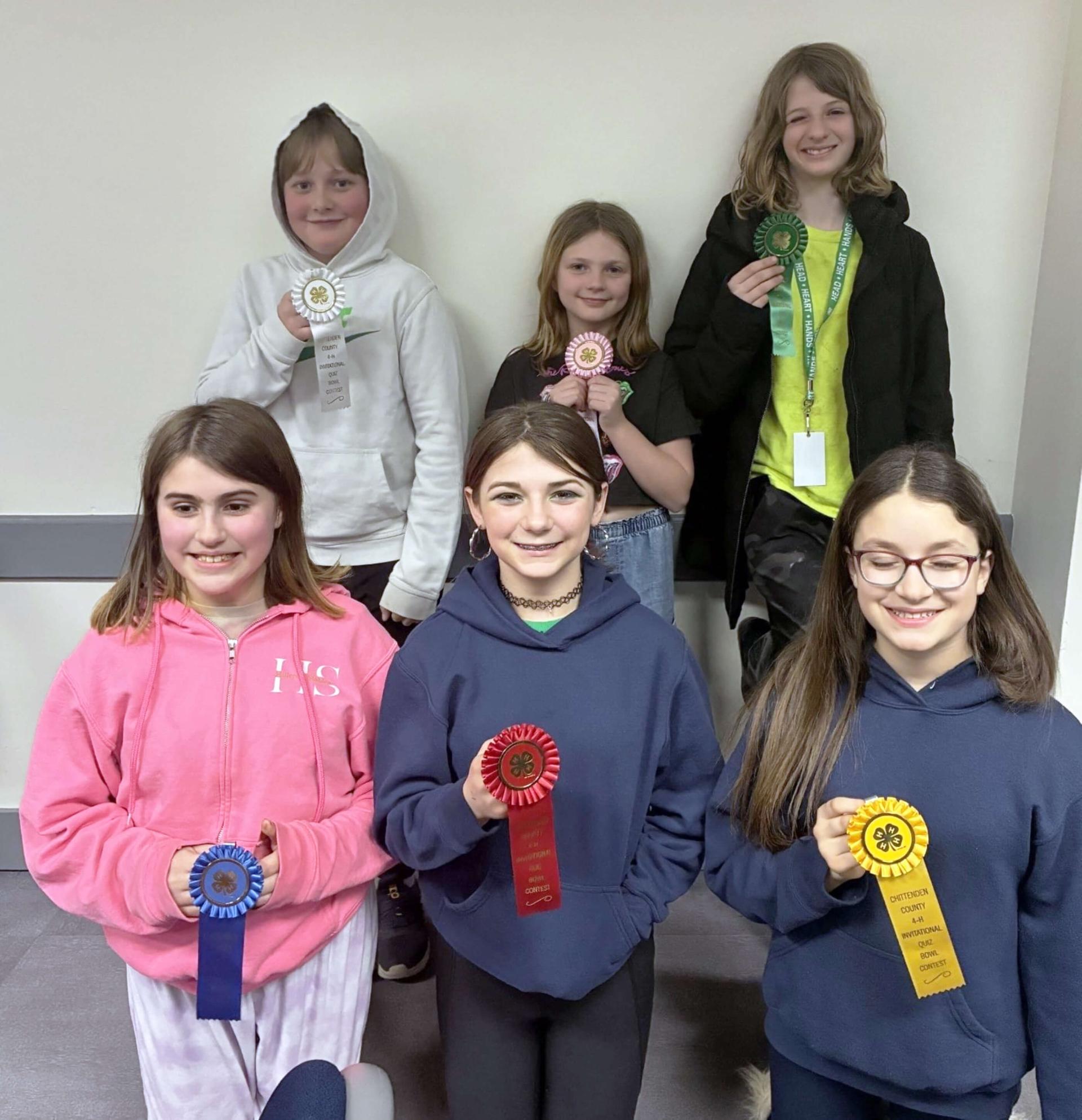 six kids holding ribbons