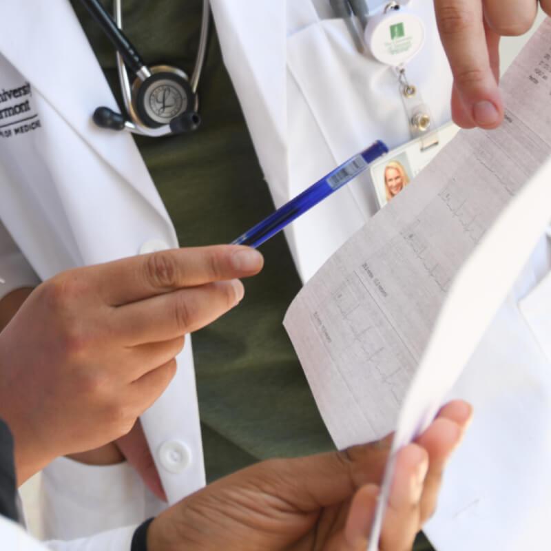 close up of doctors discussinf patient data