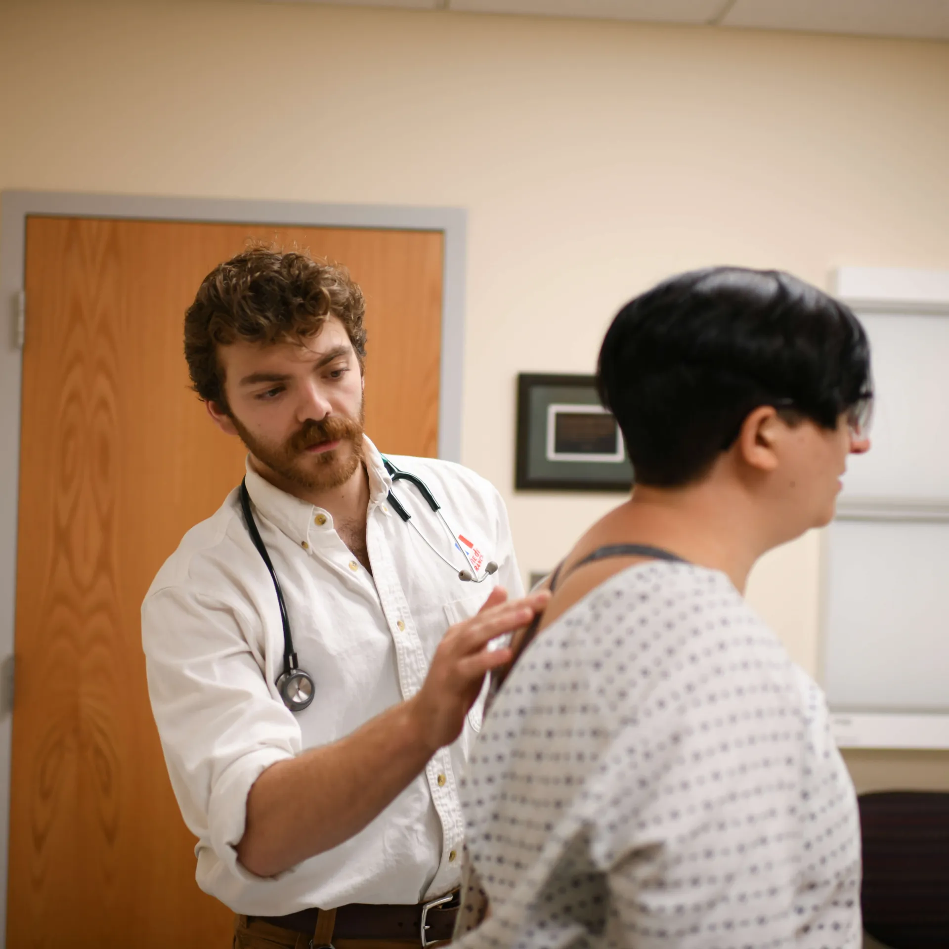 Provider checking patients spine