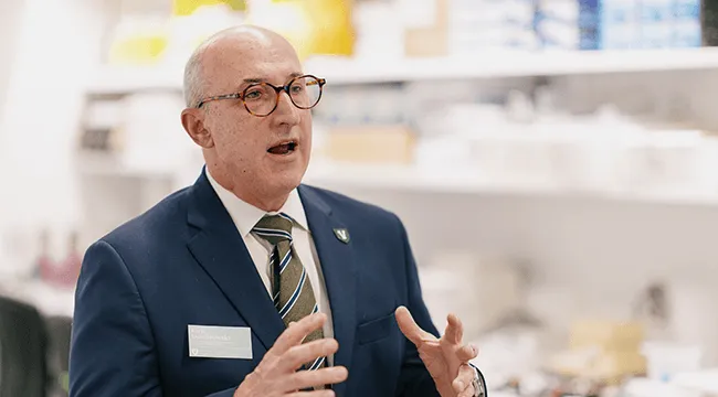 a man talking in a research lab