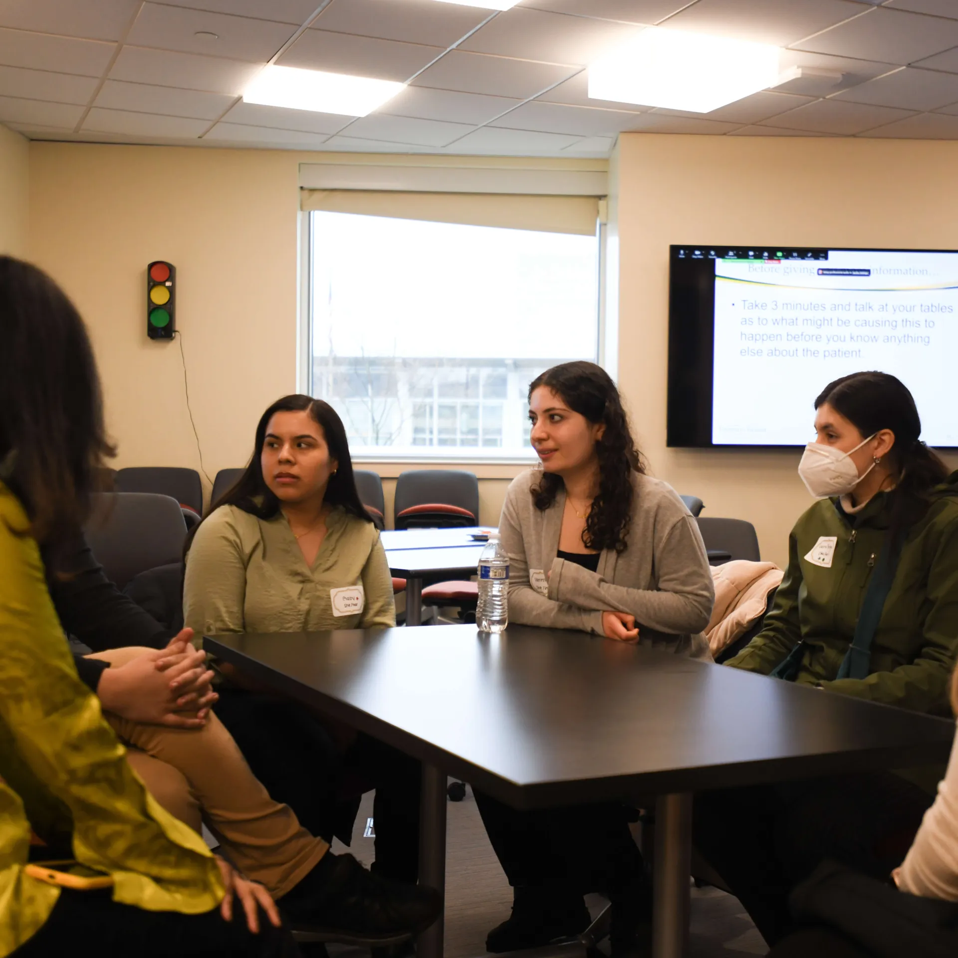 Students engaging in conversation about patient care