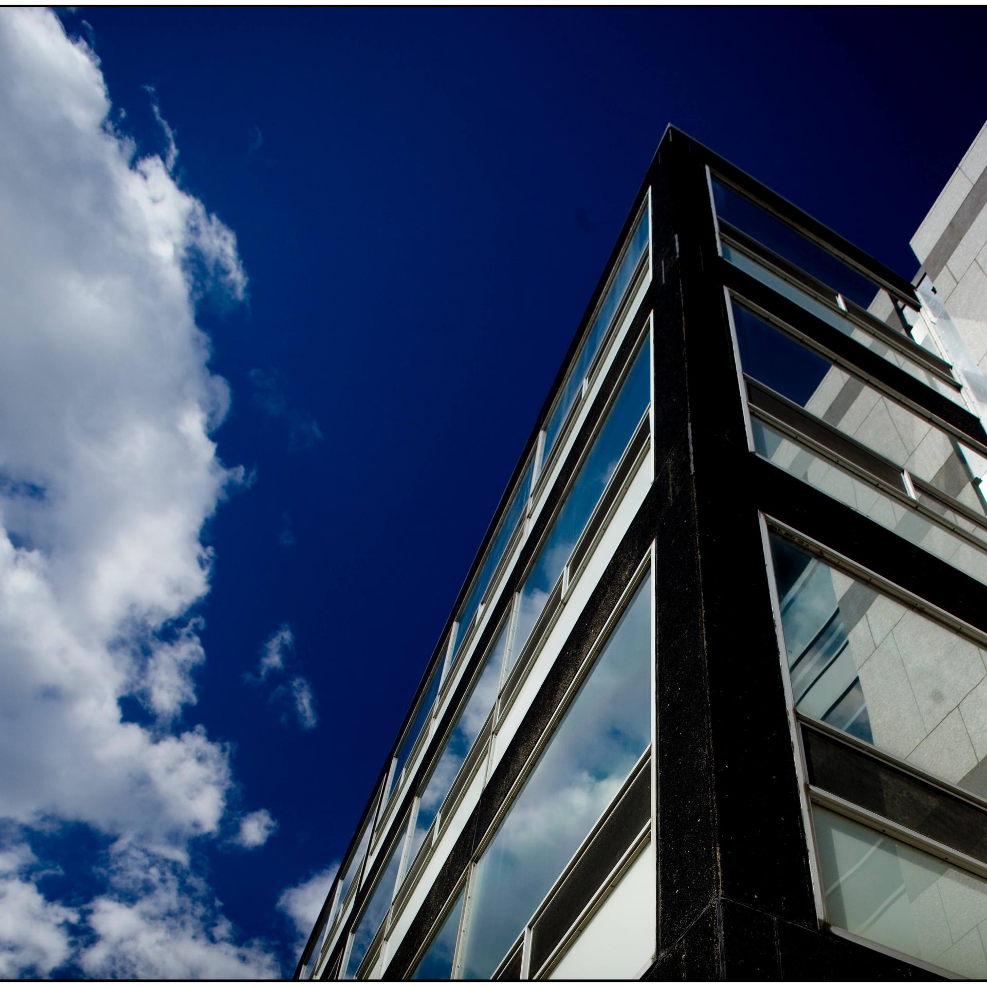 Ant's eye view of Given building with a blue sky above 