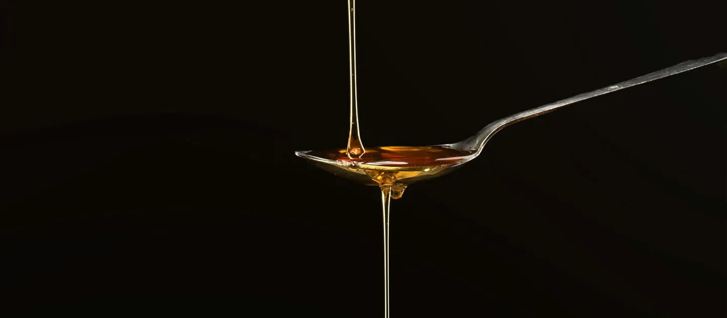 syrup dripping onto a spoon