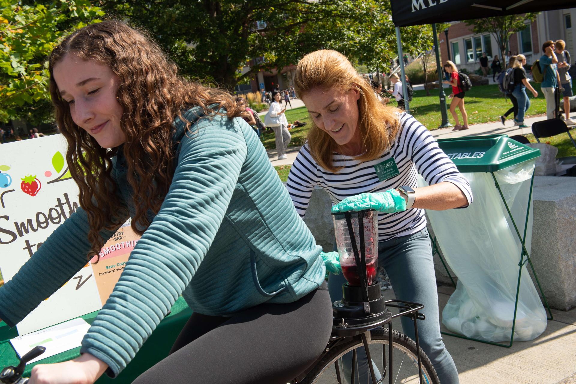 Girls pedaling smoothie bike