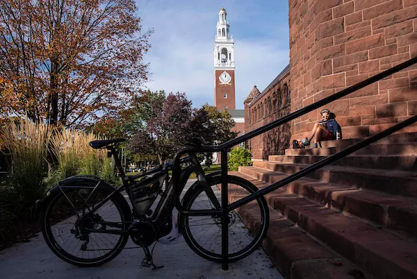 dappled sunlight on redstone steps entrance of the historic library