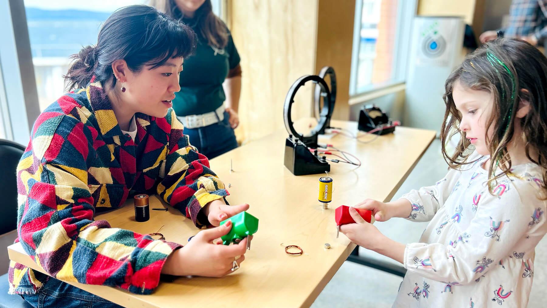 CEMS Physics student shares activities with young visitor