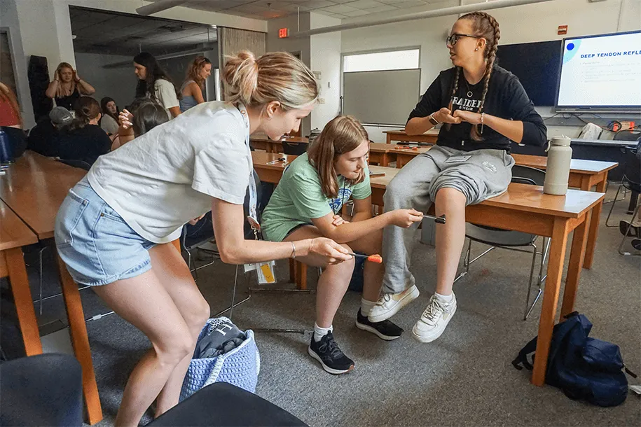 a group of people at a hands-on health careers exercise