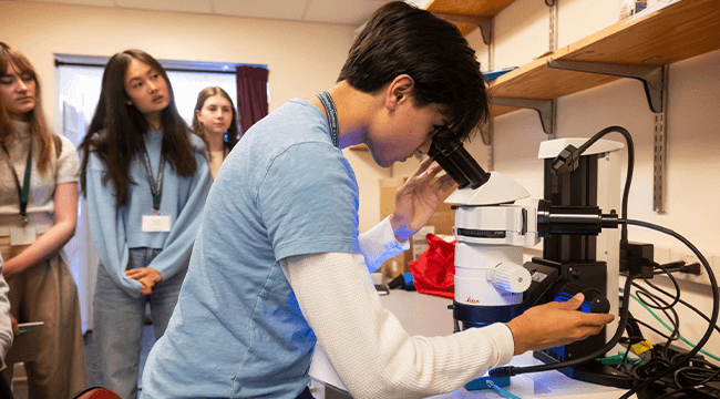 high school students in a lab