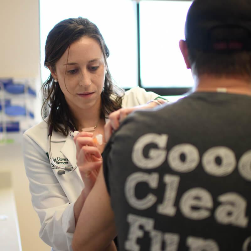 doctor giving patient a shot