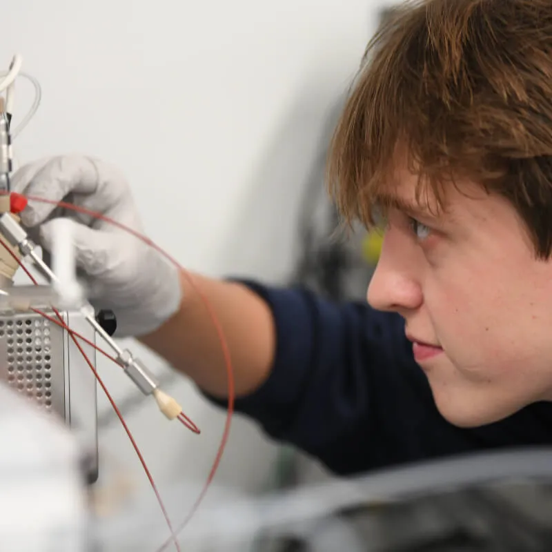 person working with equipment in a research lab
