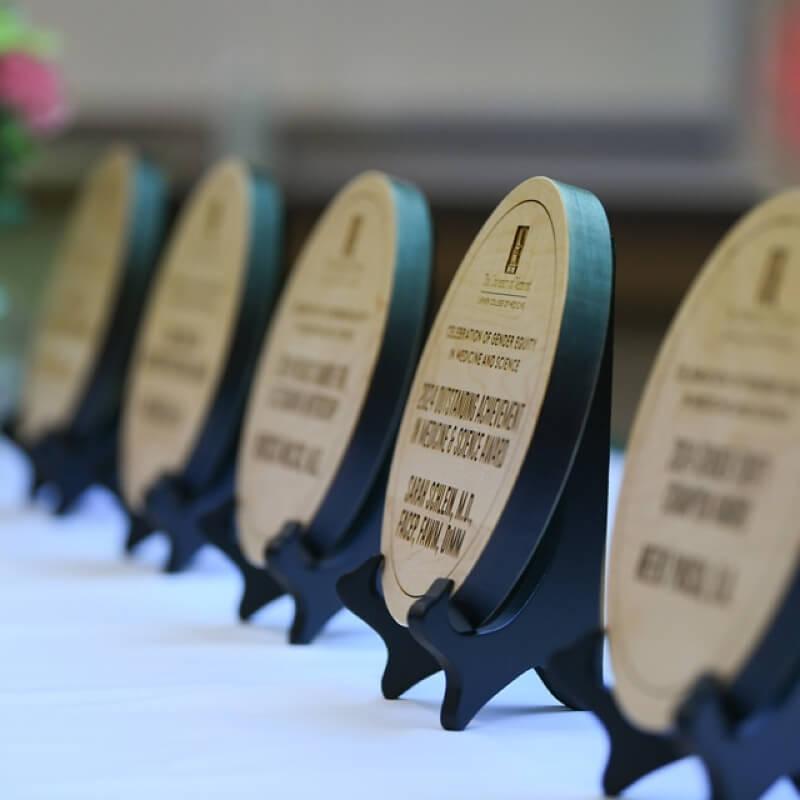 a row of wooden award plaques on a table