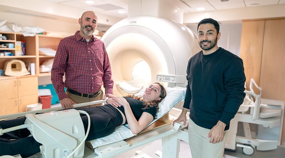 Mechanical Engineering Associate Professor Nic Fiorentino collaborates with Graduate Researcher Natalie Bett and Graduate Research Assistant Sadegh Khodabandeloo in the Larner College of Medicine's MRI Center for Biomedical Imaging.