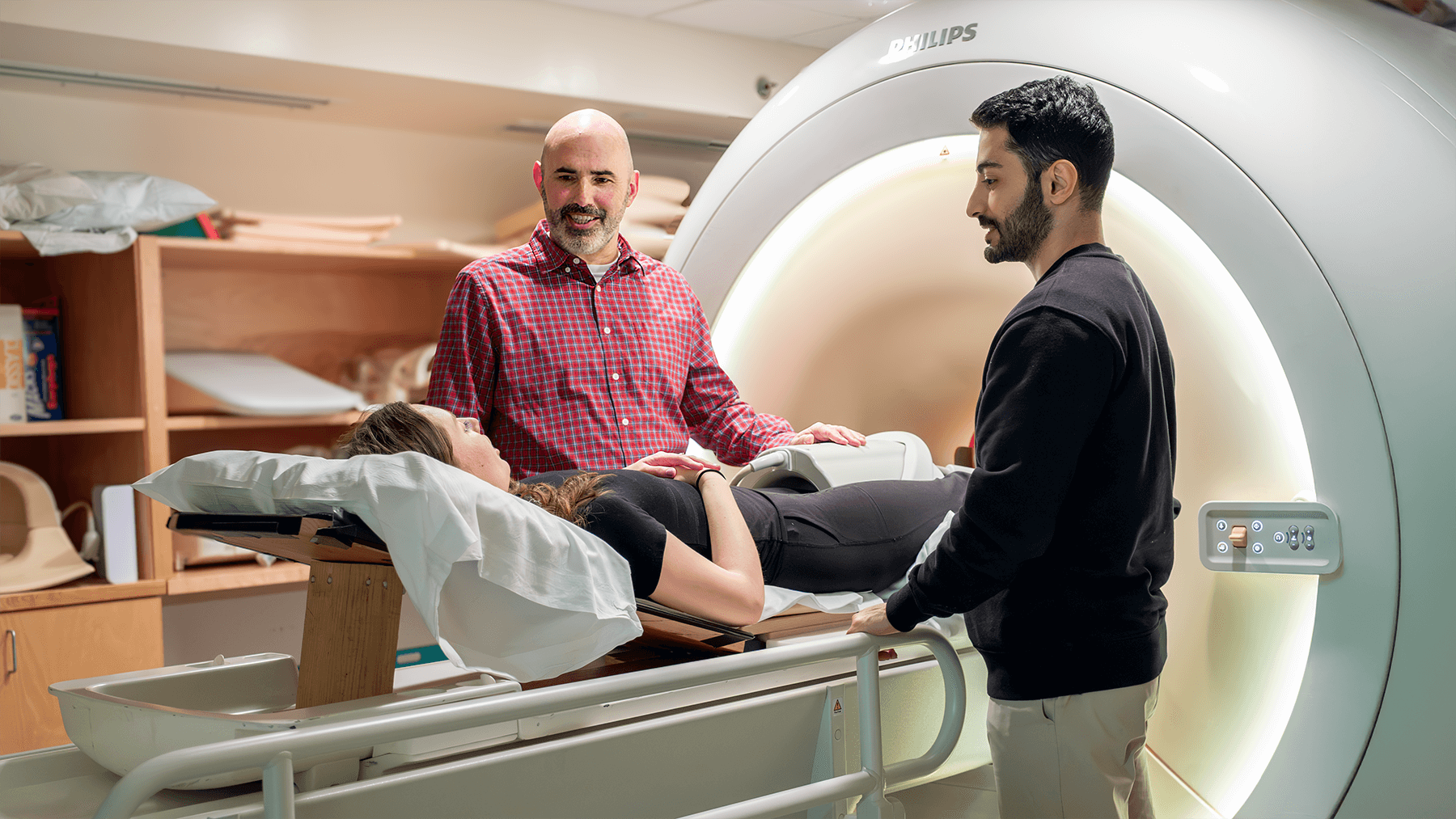 Mechanical Engineering Associate Professor Nic Fiorentino collaborates with Graduate Research Assistant Sadegh Khodabandeloo and Graduate Researcher Natalie Bett during a trial at the Larner College of Medicine's MRI Center for Biomedical Imaging.