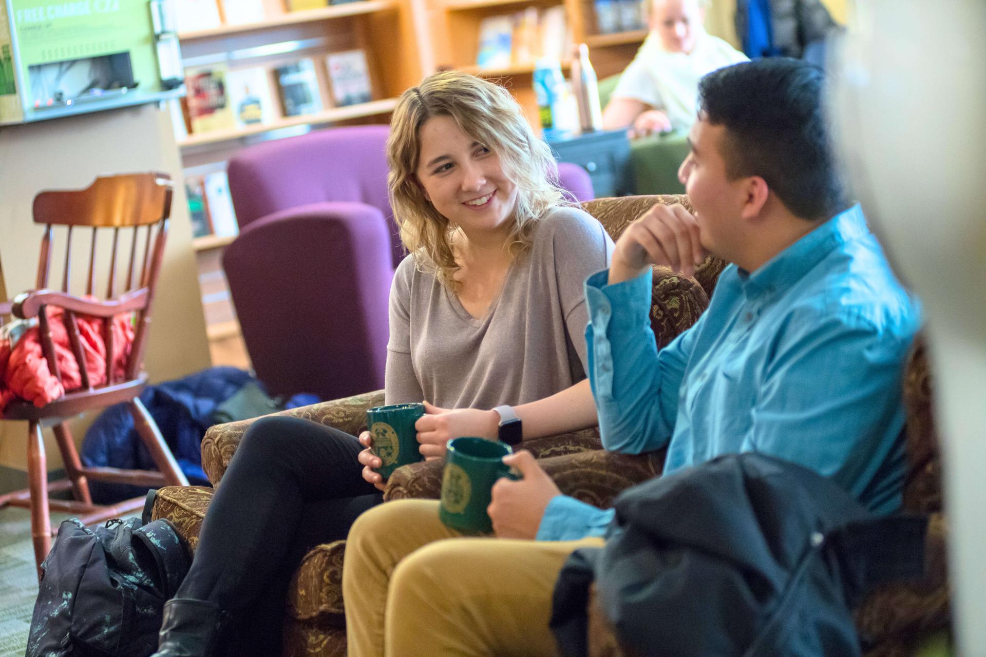 Two students socializing in a coffees shop