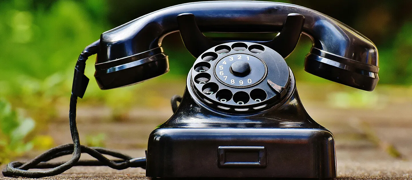 an old rotary phone outdoors