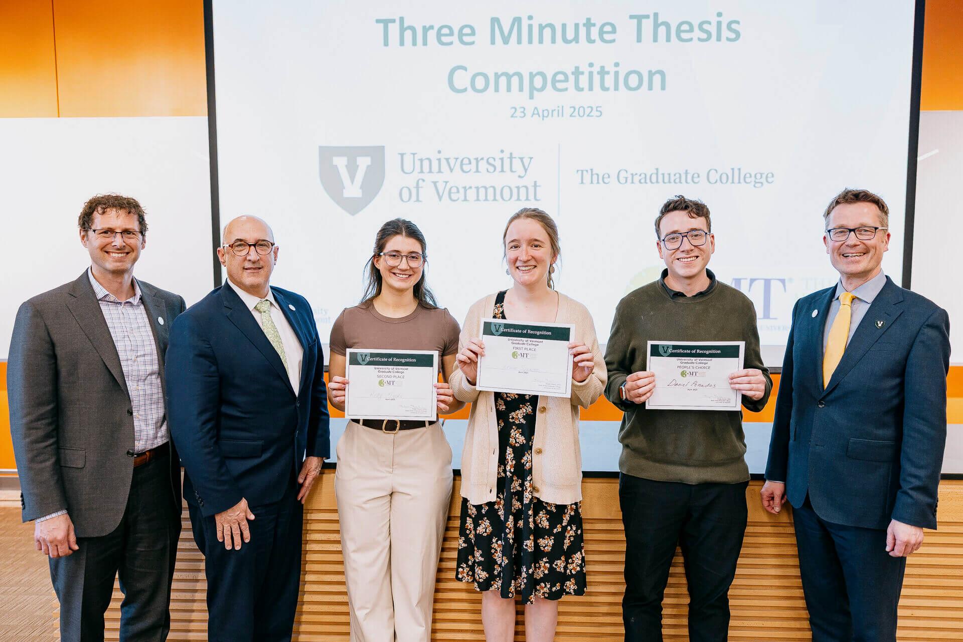 The winners of the three-minute thesis contest holding their award certificates