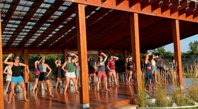 Students in an outdoor dance class