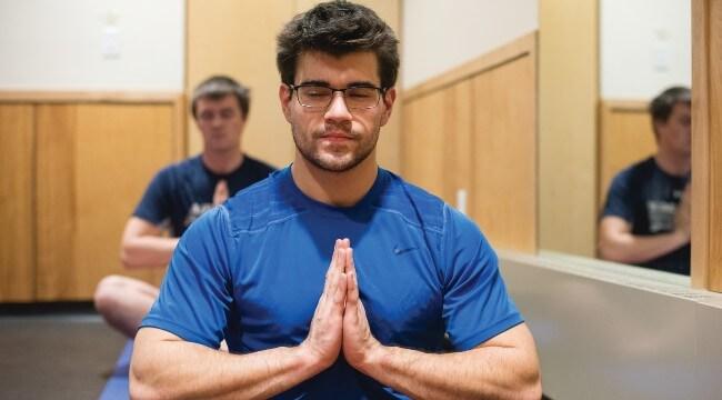 A student practices yoga