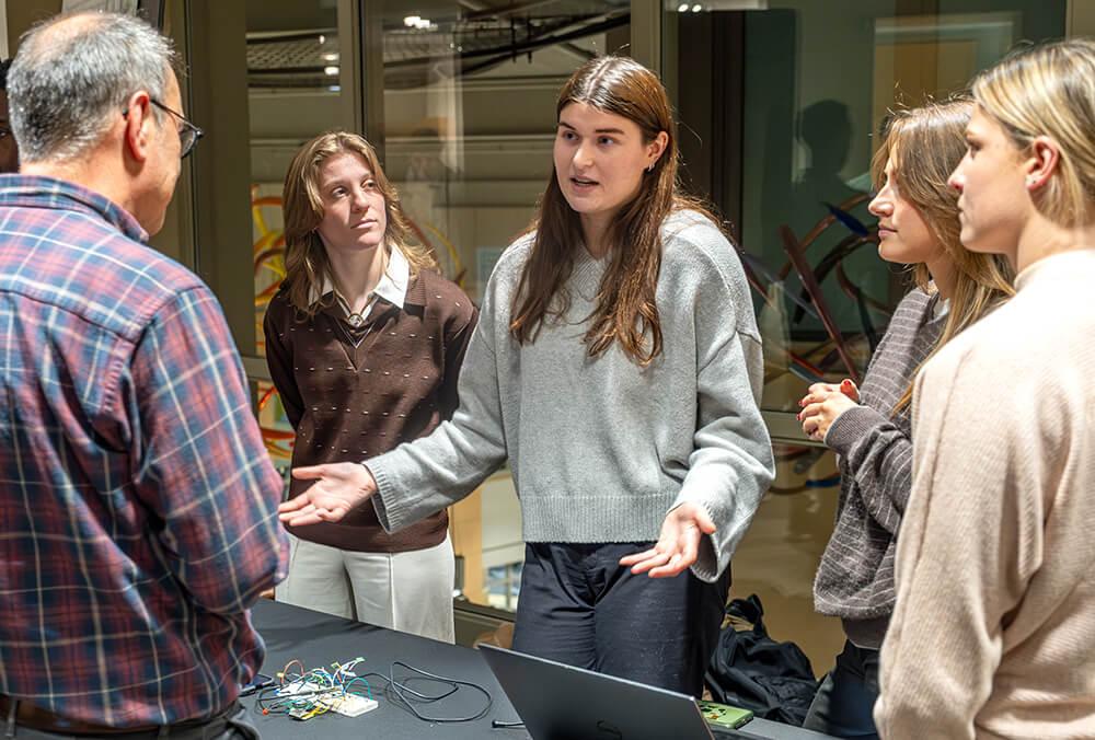 Anna Shoudt presents alongside her team members (Regan Miller, Elizabeth Manero, Chiamaka Ozigbo, Bila Bogre, and Emma Petrucci) during the Fall 2024 Biomedical Engineering Design Evening. Their project, "Neuroplay: Revive the Mind," modified an original "Bop-It" toy to improve cognitive skills in children during rehabilitation.