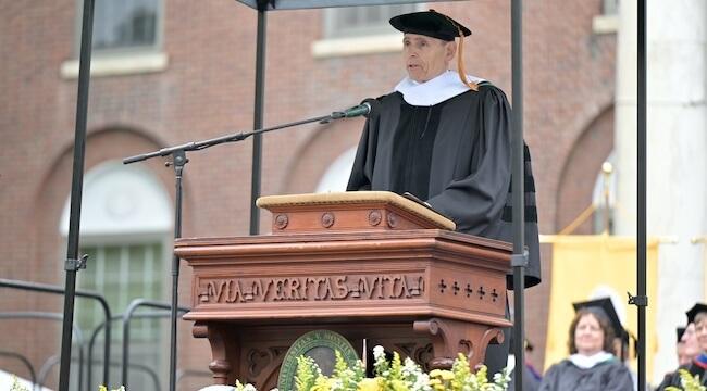 man speaking at podium