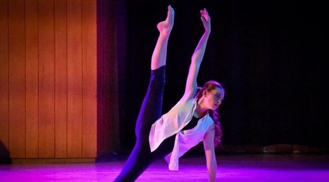 dancer performing in colored light