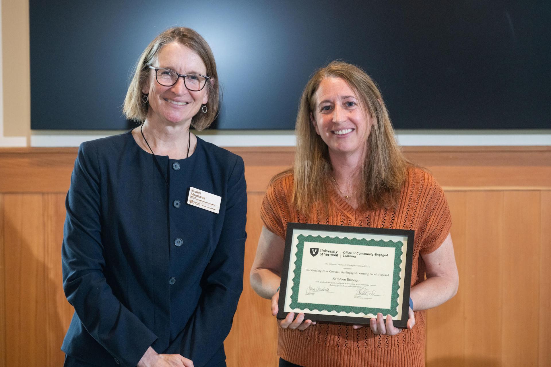 Kathleen Brinegar receives the New Community-Engaged Learning Faculty Award from CELO Director Susan Munkres