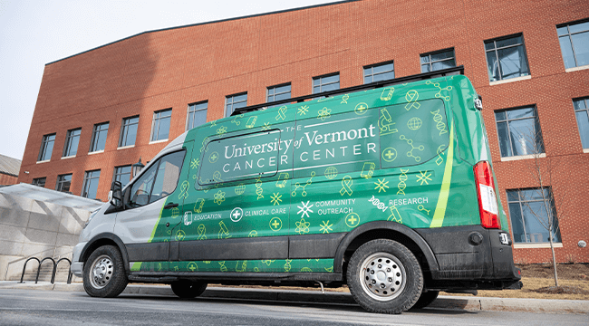 The UVM Cancer Center's branded van on the University of Vermont campus