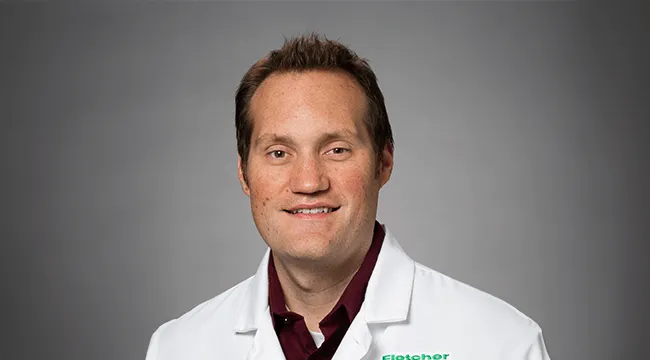 a man in a white coat