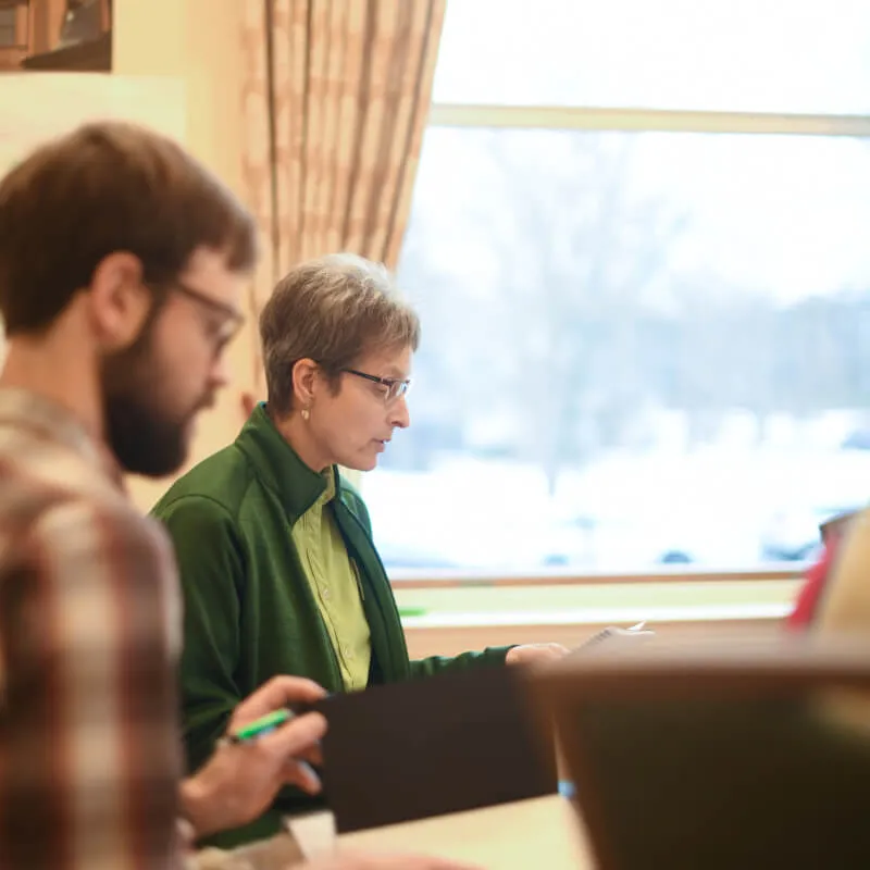 two people looking at paperwork
